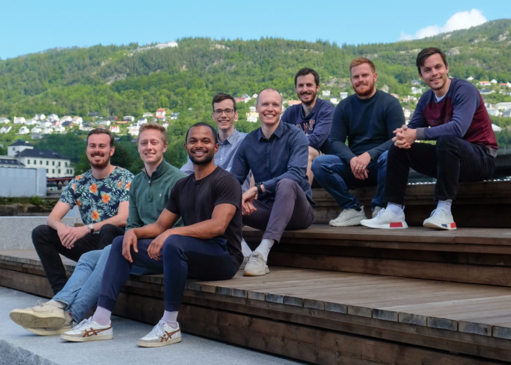 The Birdsview team sitting in stairs on sunny day